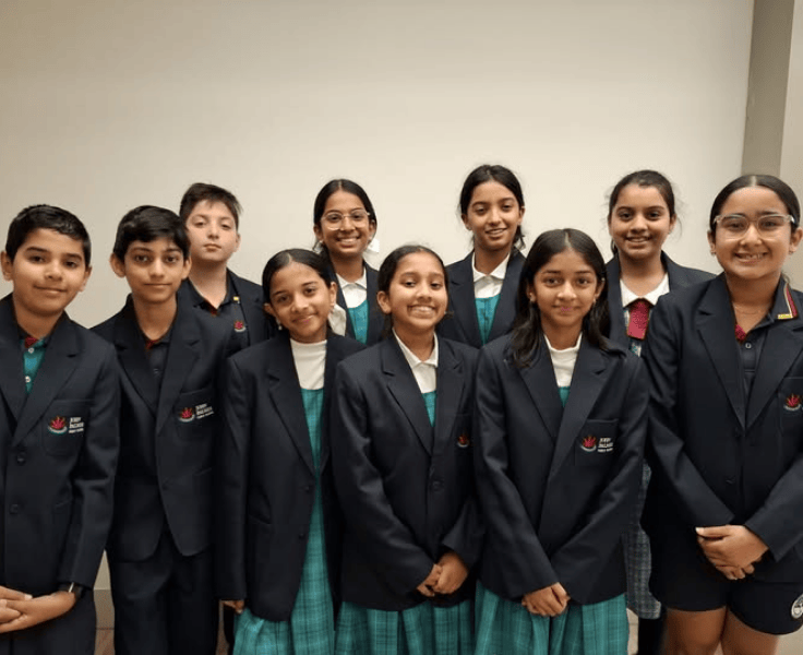 Ten students in the JPPS debating team wearing the official school representative blazers